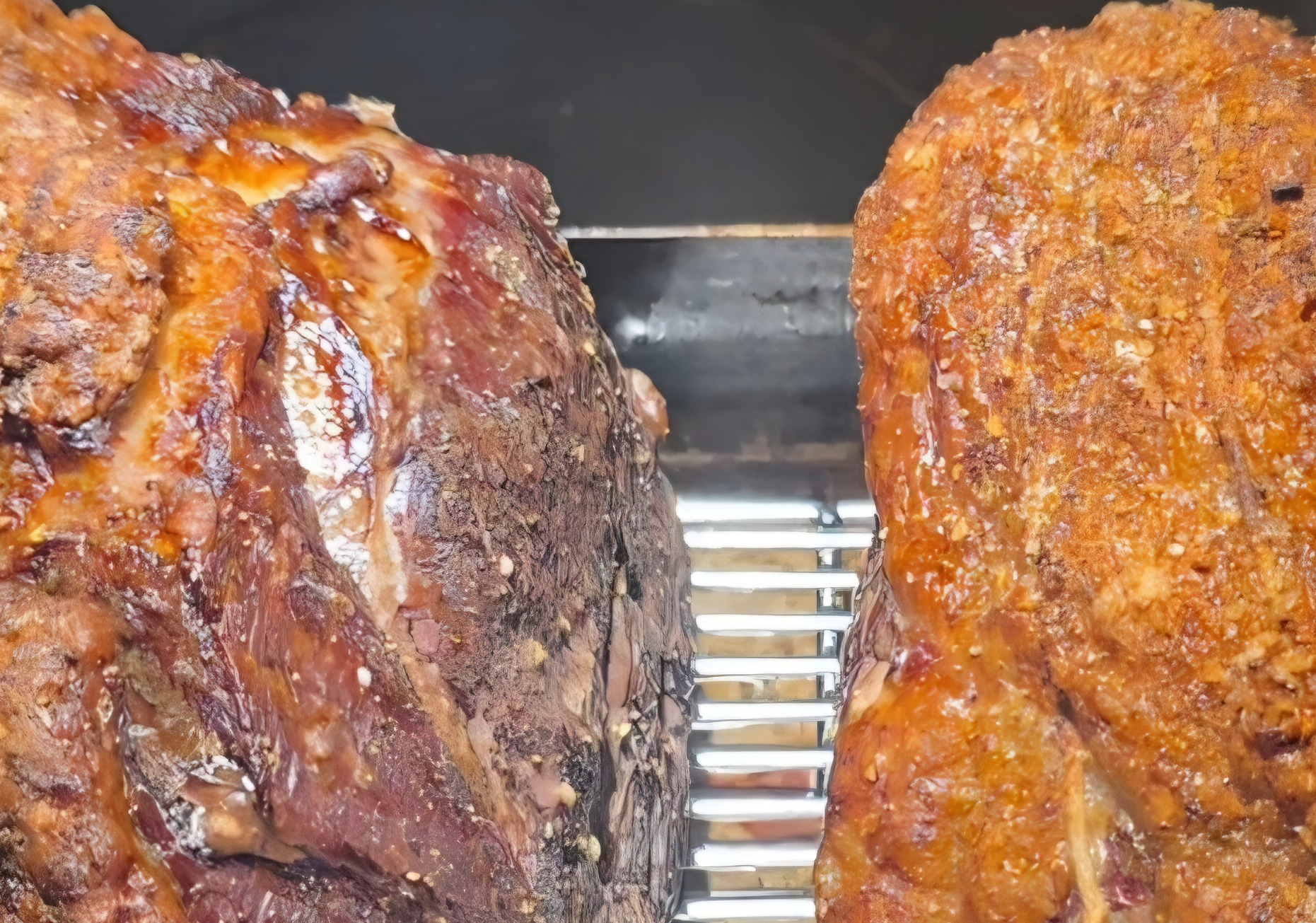 Whole reverse-sear beef roast with a crispy golden crust on a white platter